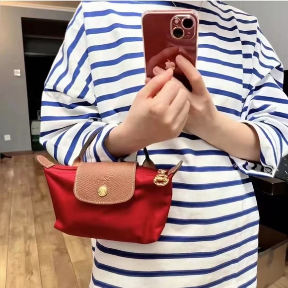 Longchamp Handbags - Longchamp Le pliage original pouch with handle red color